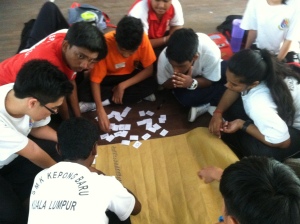 Students doing a word scramble at camp